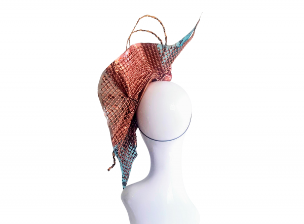 Plastic Fantastic recycled Hat in aqua blue and coral pink check with copper rope like quills and copper foam waffle backing all sited on the right had side of a white gloss mannequin head