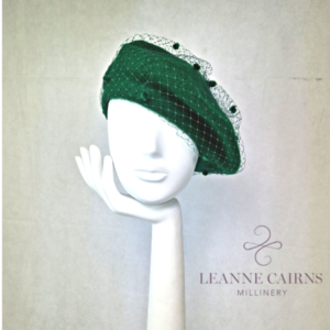 Emerald Green Wool French Beret and velvet ribbon detailed style hat on mannequin , front view