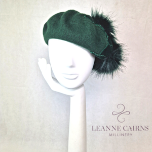 Forrest Green Wool French Beret and velvet ribbon detailed style hat on mannequin , front view