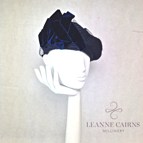Navy Blue Wool French Beret and velvet ribbon detailed style hat on mannequin , front view
